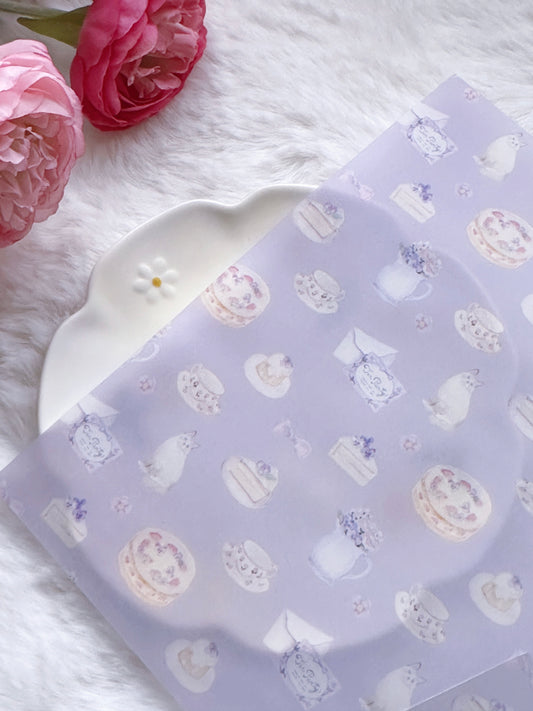 Sheet of decorative stickers with cake designs on a white surface with pink flowers, nz, vellum paper, purple, cute, cat, tea, party, gift wrapping, paper